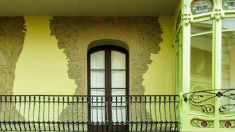 wooden door in the yellow house balcony