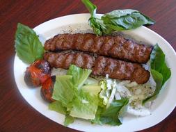 Spicy kebab with lettuce leaves