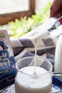 dripping white yogurt in a glass