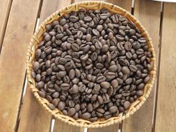 ripe aromatic coffee beans in a basket
