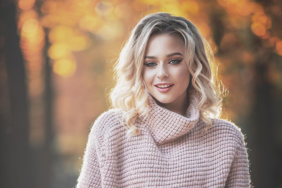 blonde in a sweater in the park