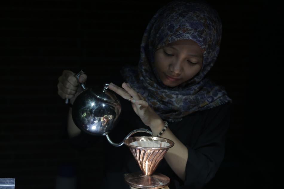girl in scarf with a kettle for coffee