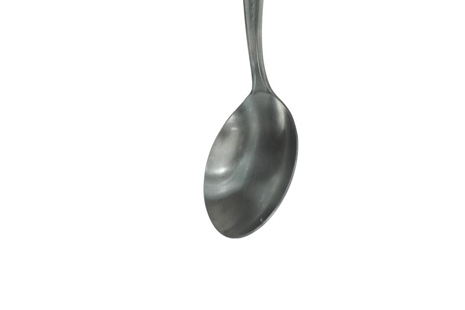 iron spoon on white background