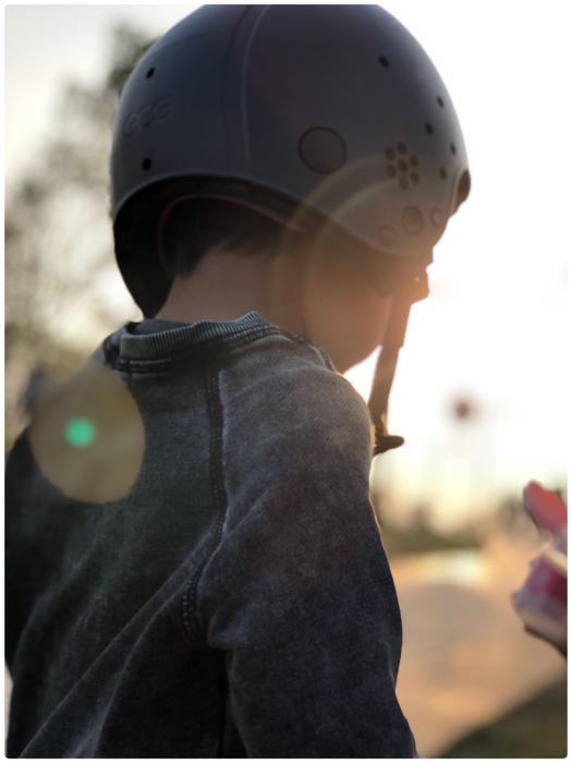 boy in helmet, rays of the sun