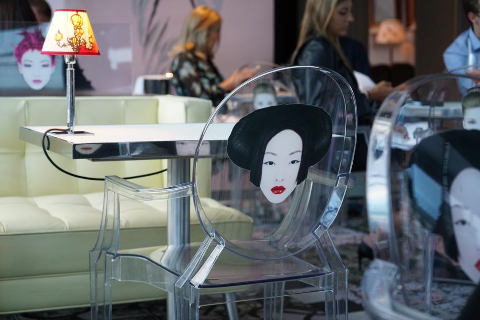 glass chairs with a picture of a girl face