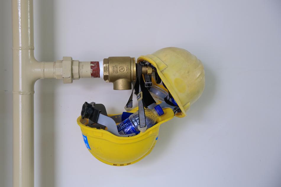 helmet yellow kind of iron pipe