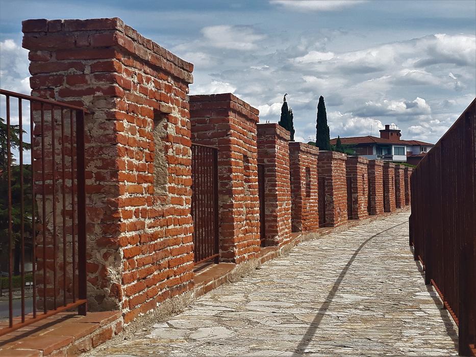 stone columns with a fence