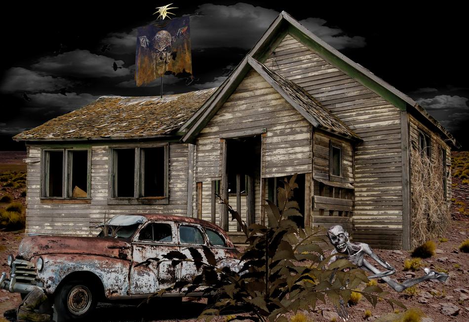 an old broken-down house with a car