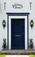 blue door with lights at the entrance