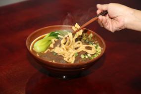 meat dish with noodles and soup