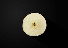 piece of apple on a black background