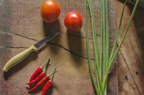 ripe vegetables and a knife on the table