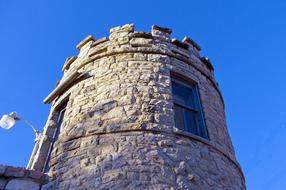 big stone tower on a blue background