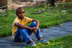 Child Boy sitting on ground