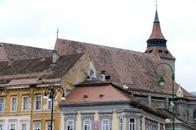 an old house with a brownstone roof on the street