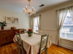 a cozy room with a chair and chairs