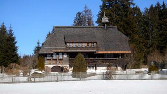 an old house with a snowy view