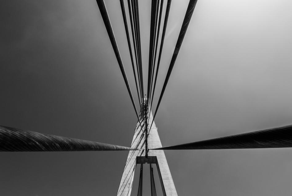 wires bridge water mountain