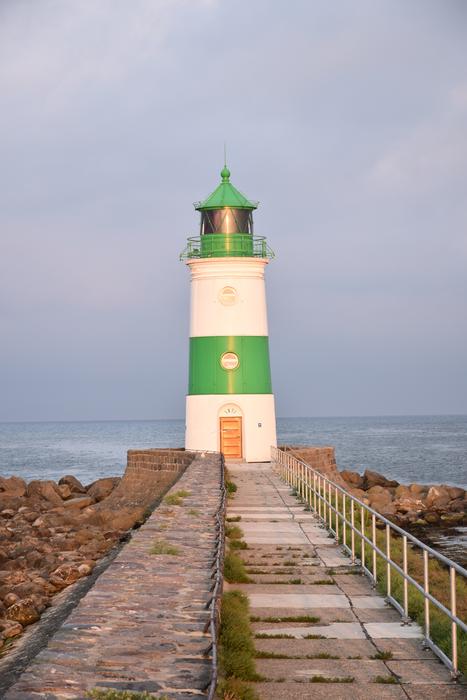 white lighthouse with green stripes