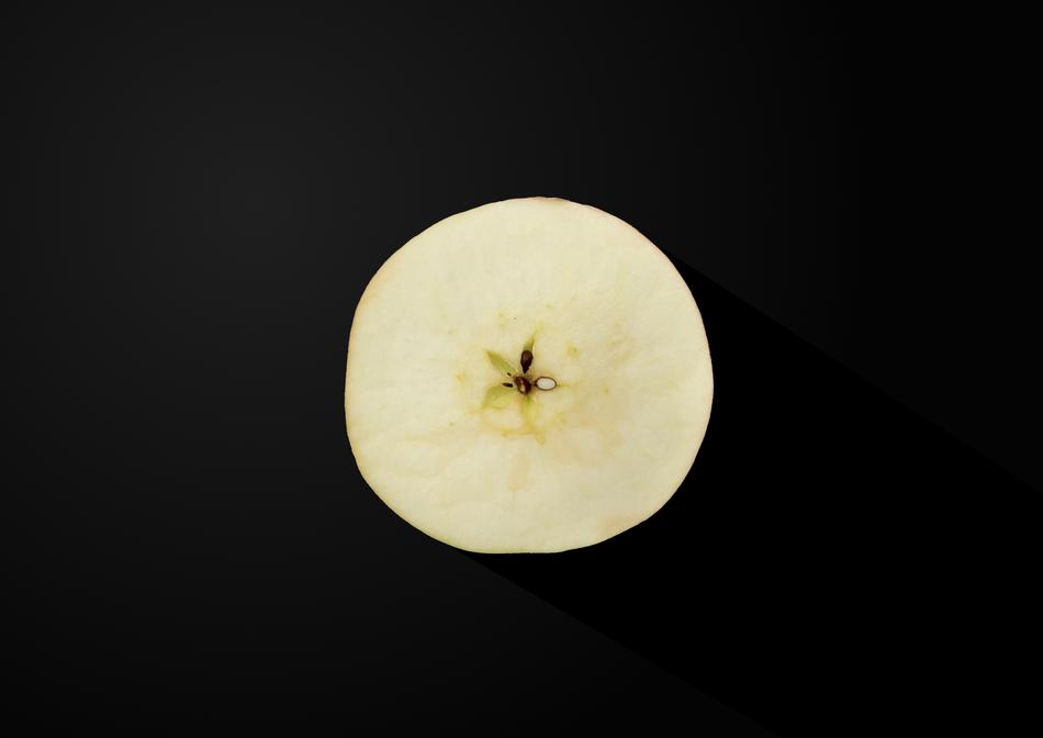 piece of apple on a black background