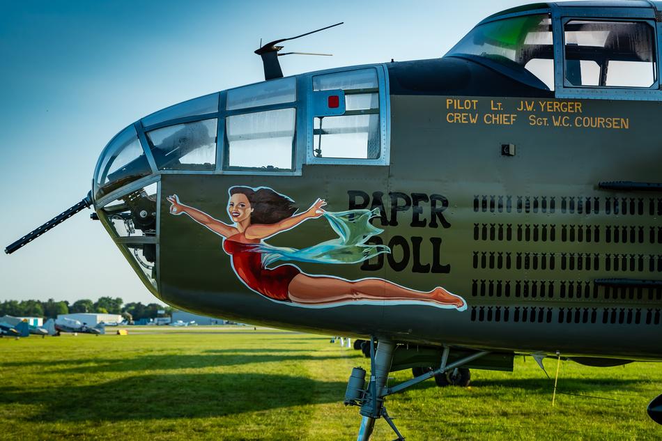an iron airplane with a girl in the picture
