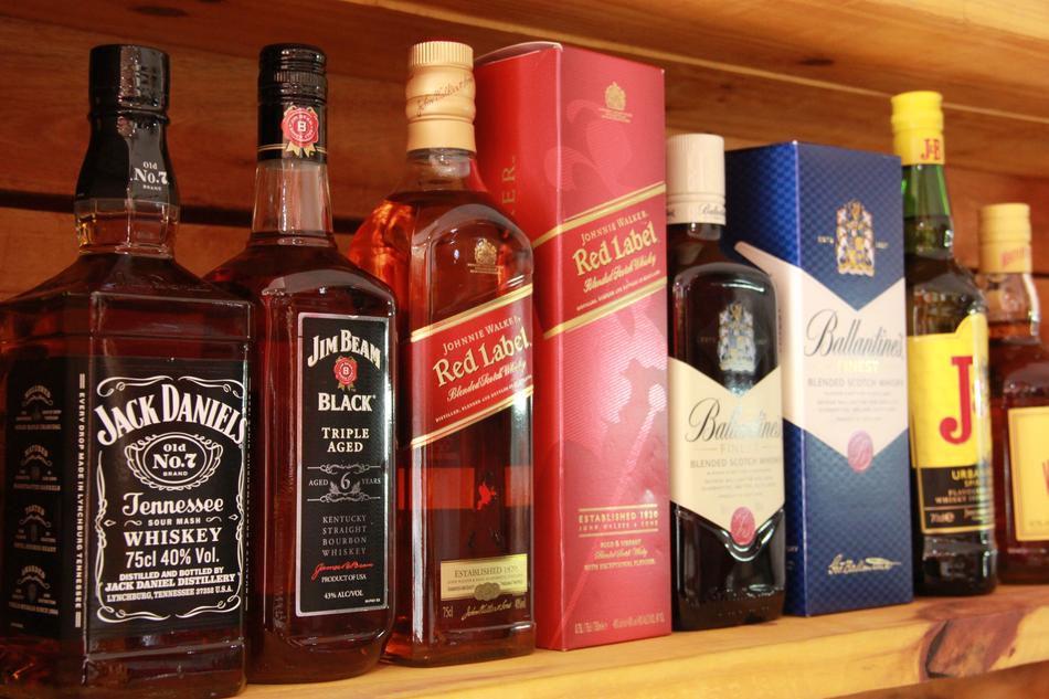 bottles of alcoholic beverages at the bar