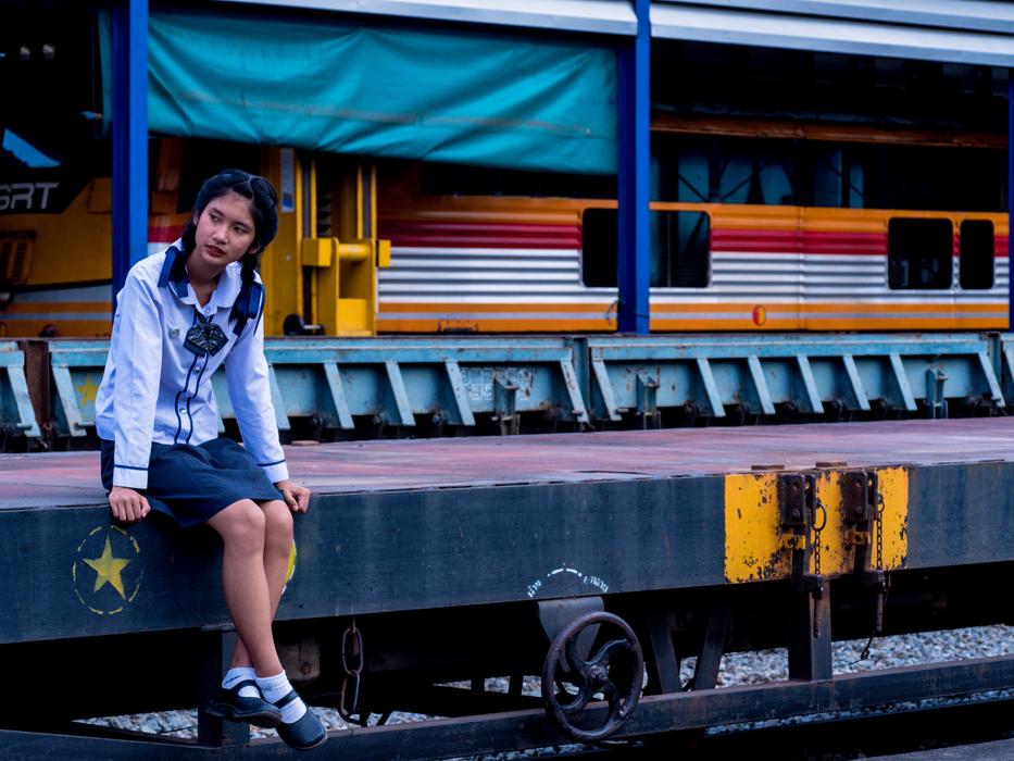 resting girl by the water