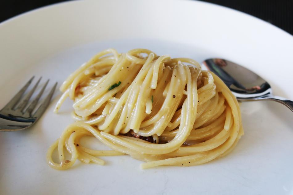 Cheese paste on a plate with a spoon and fork
