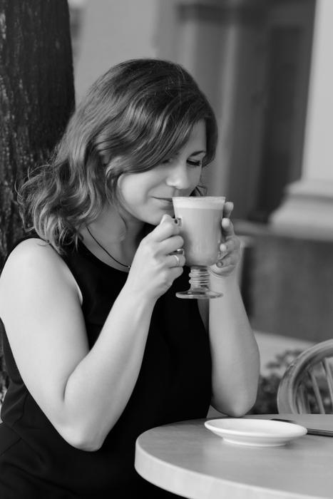 Beautiful girl enjoying her coffee