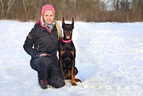 dog and girl in the snow