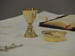 gold cup with decorations on the table