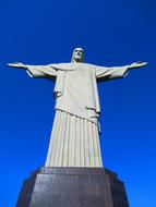 the sculpture of jesus in the blue sky