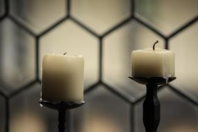 wax candles by the window