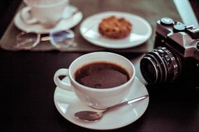 camera with hot coffee and cookies