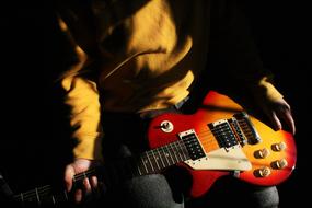 singer with electric guitar