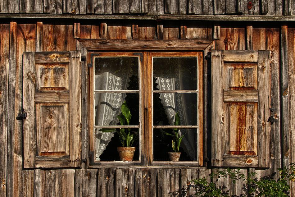old wooden house with flowers