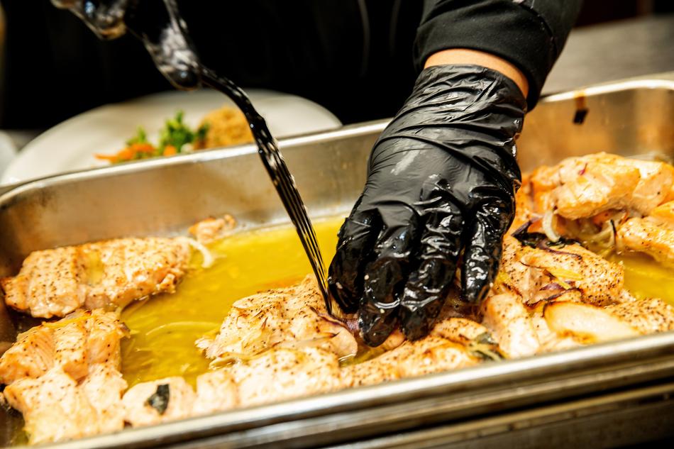 slicing fish on a plate