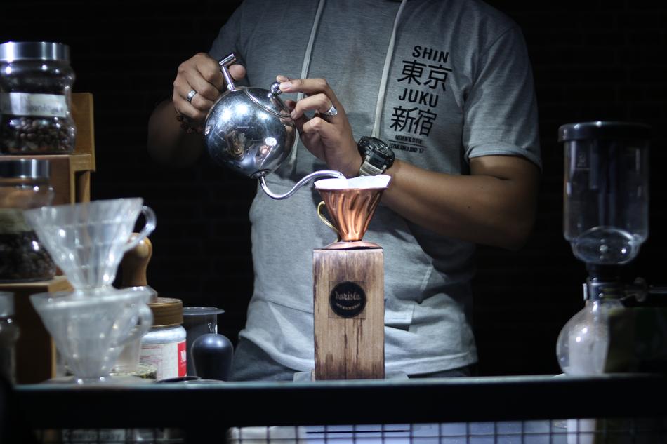 barista makes hot coffee