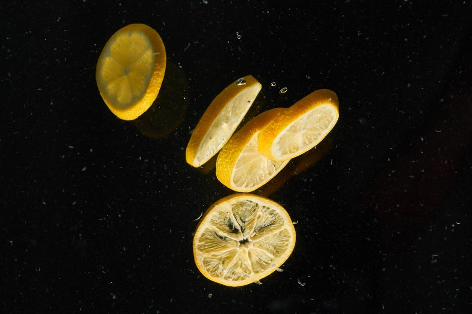 Juicy sliced lemons in the air