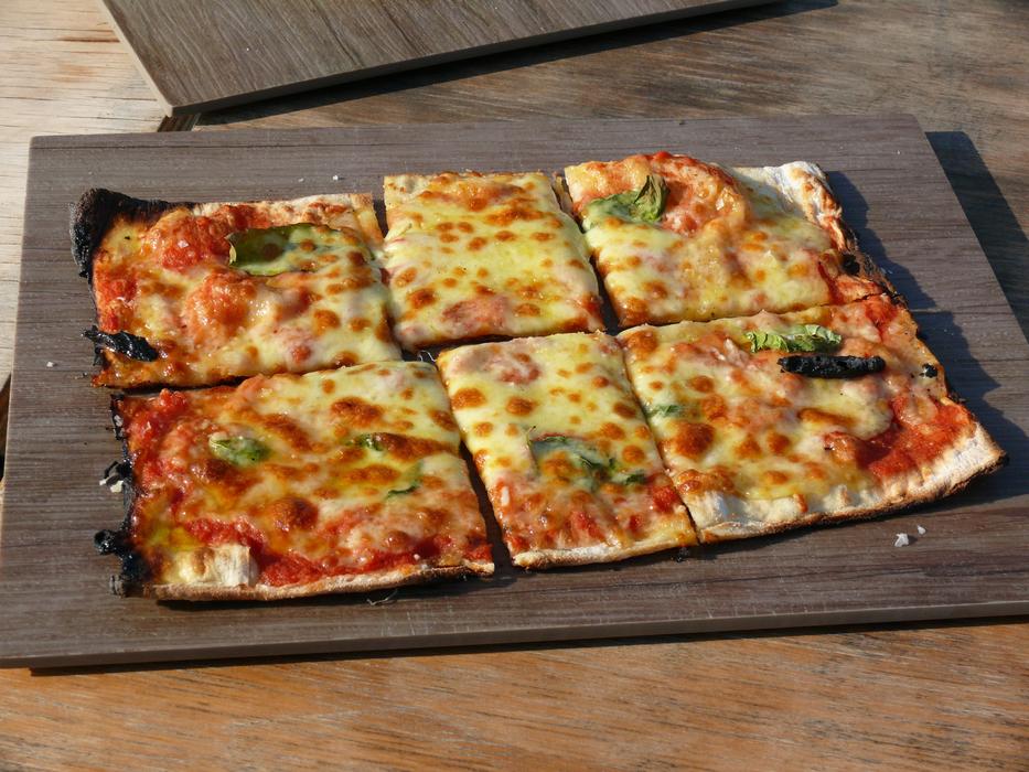 delicious pizza sliced in squares