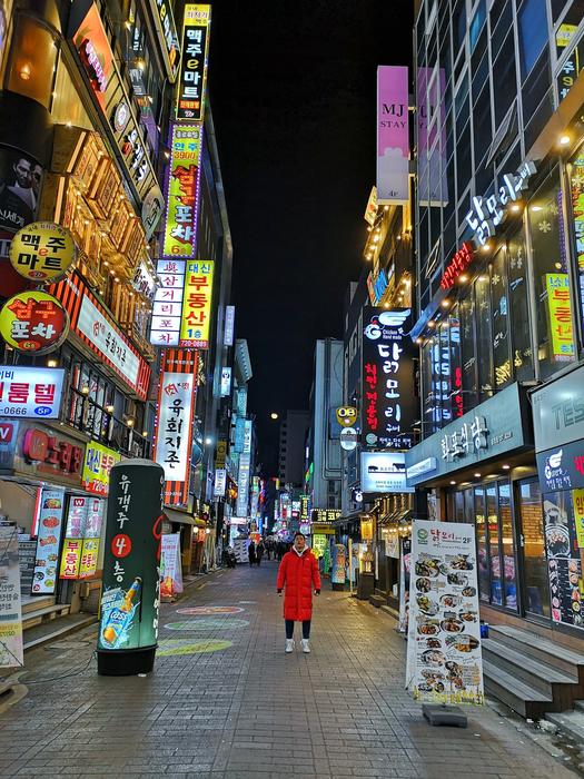 Korean night city with a man
