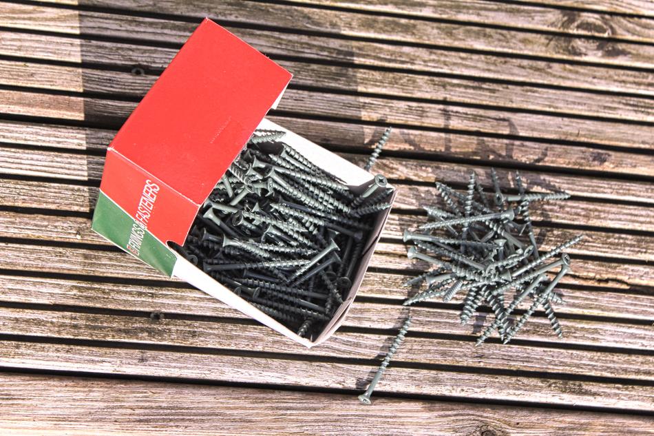 Screw Wooden flooring and nails in a red box