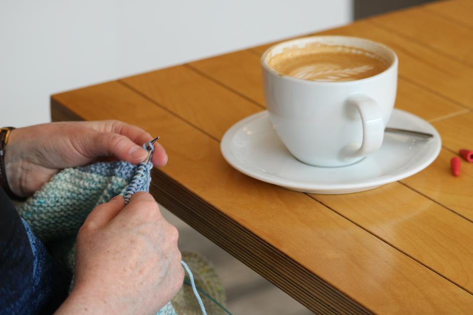 human knits in the background of sweet coffee