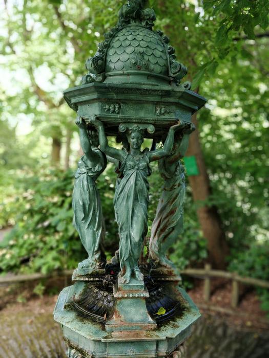 green stone woman fountain