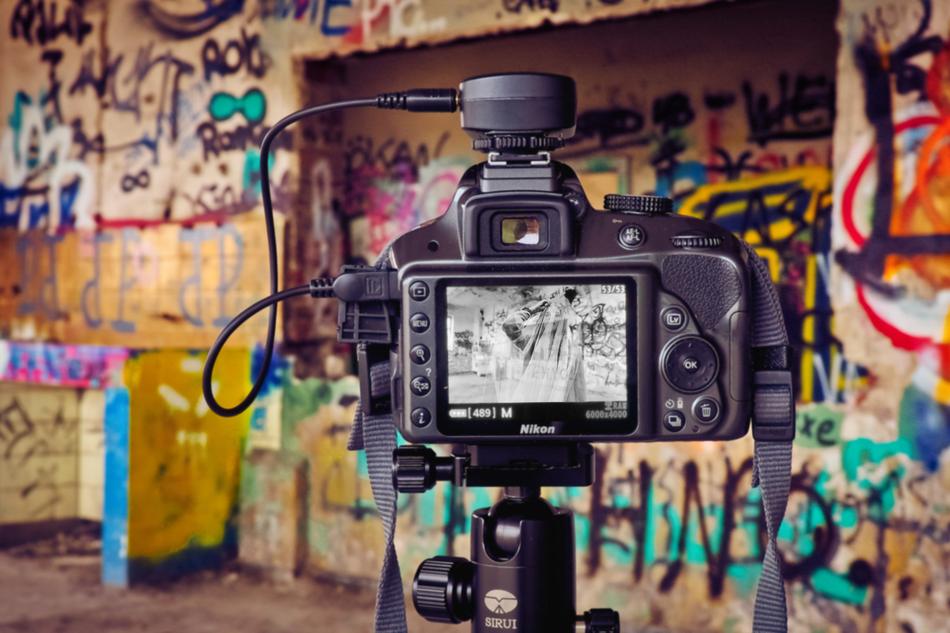 black camera with a graffiti look