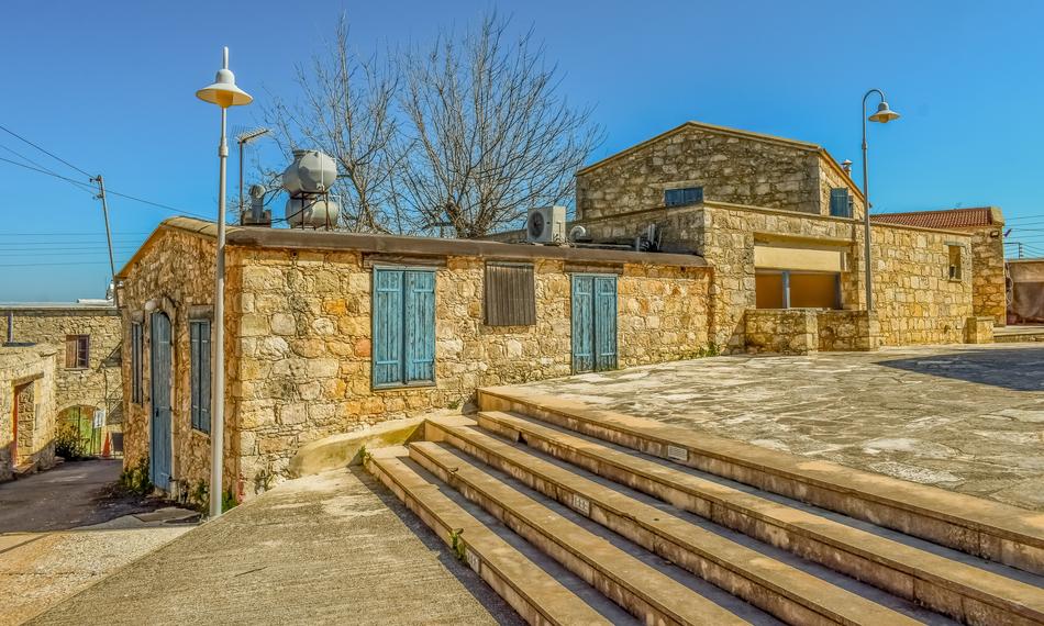 stone house with windows by the road