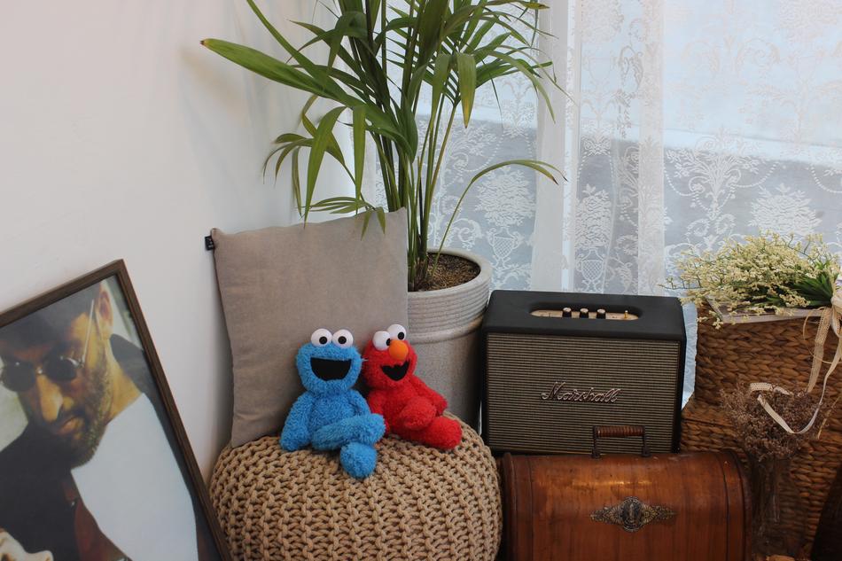 colored toys on a cushioned chair