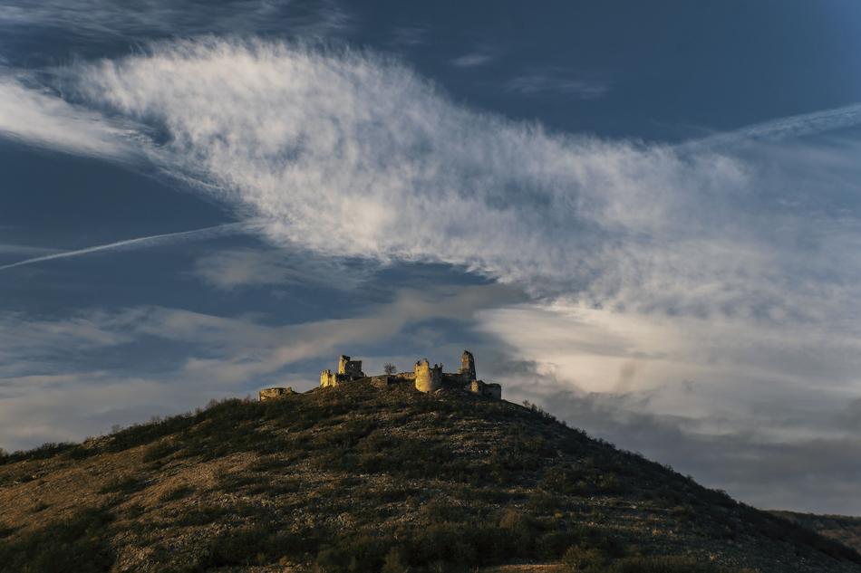 castle on a hill in the distance