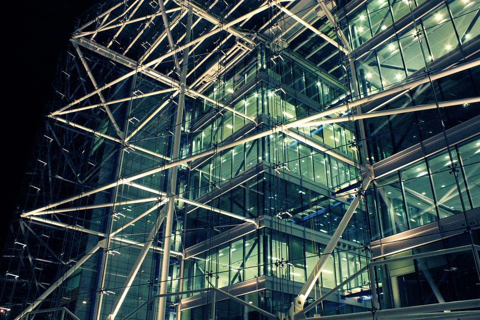 a glass building with iron pipes